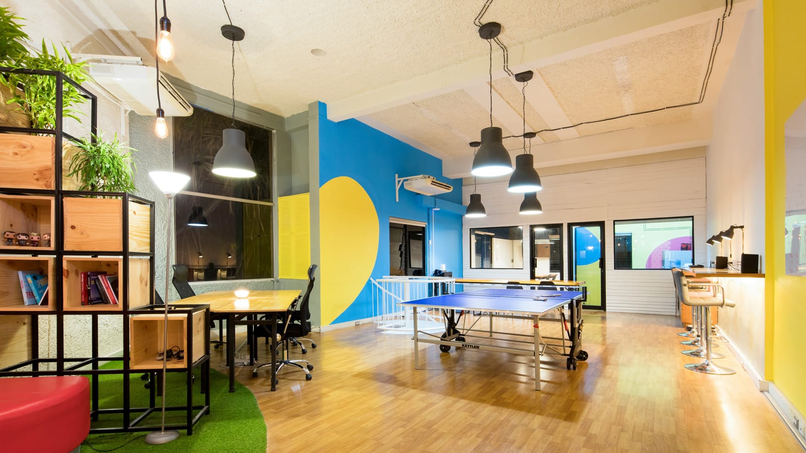 Open startup office workspace with desks and modern furniture for a growing team